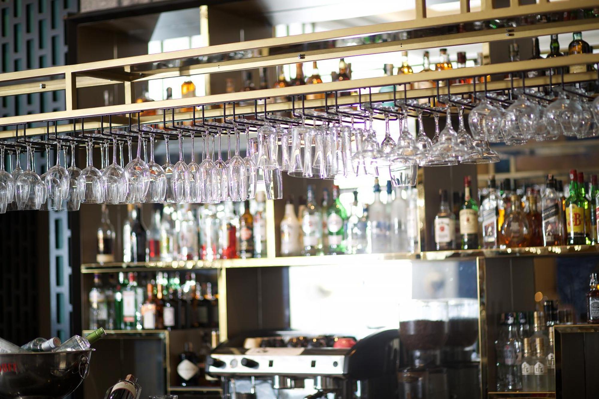 Ramada By Wyndham Istanbul Merter Exterior photo Wine glasses hanging above a bar